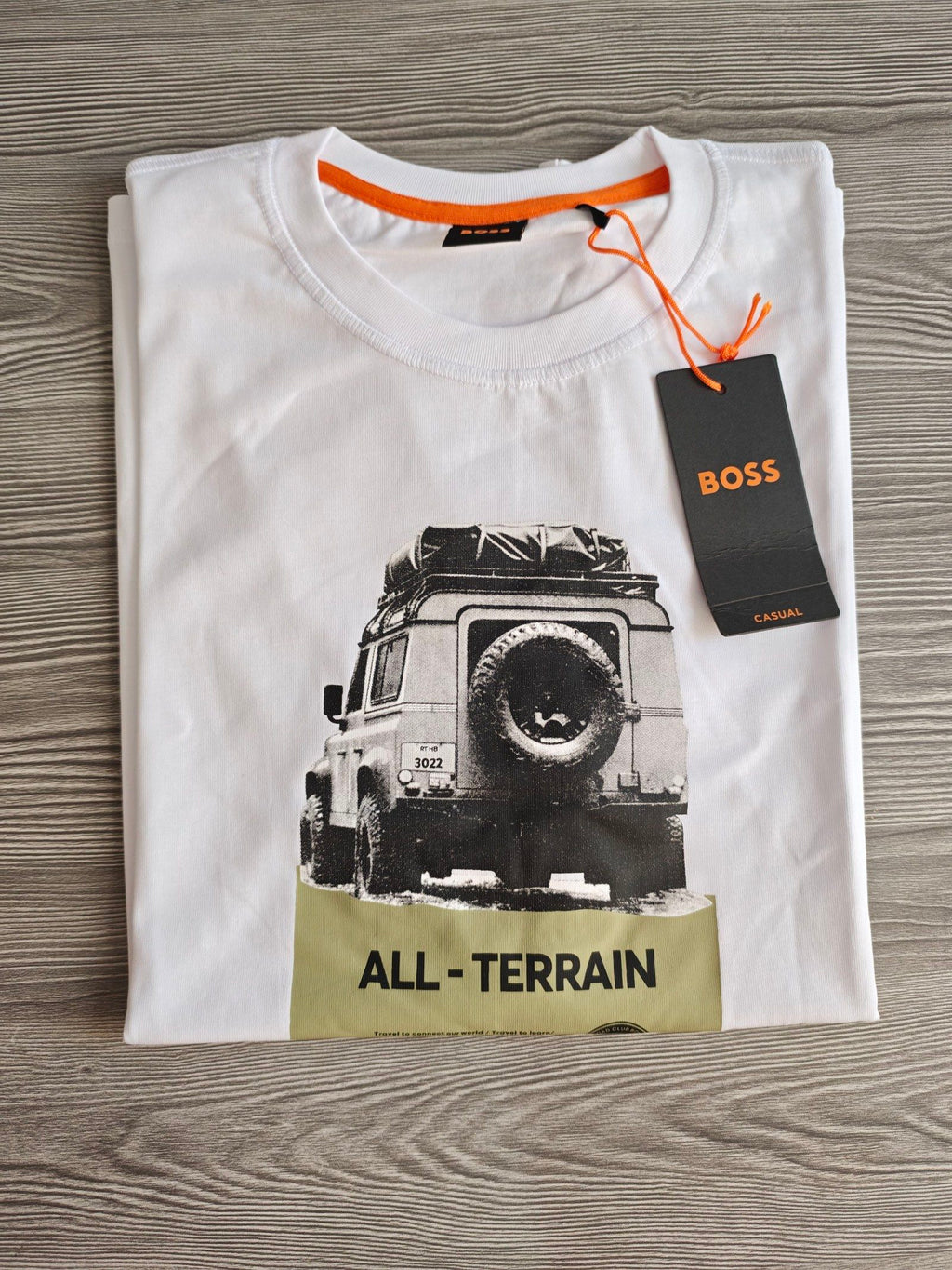 BOSS white graphic t-shirt featuring black and olive all-terrain vehicle print, 100% cotton.