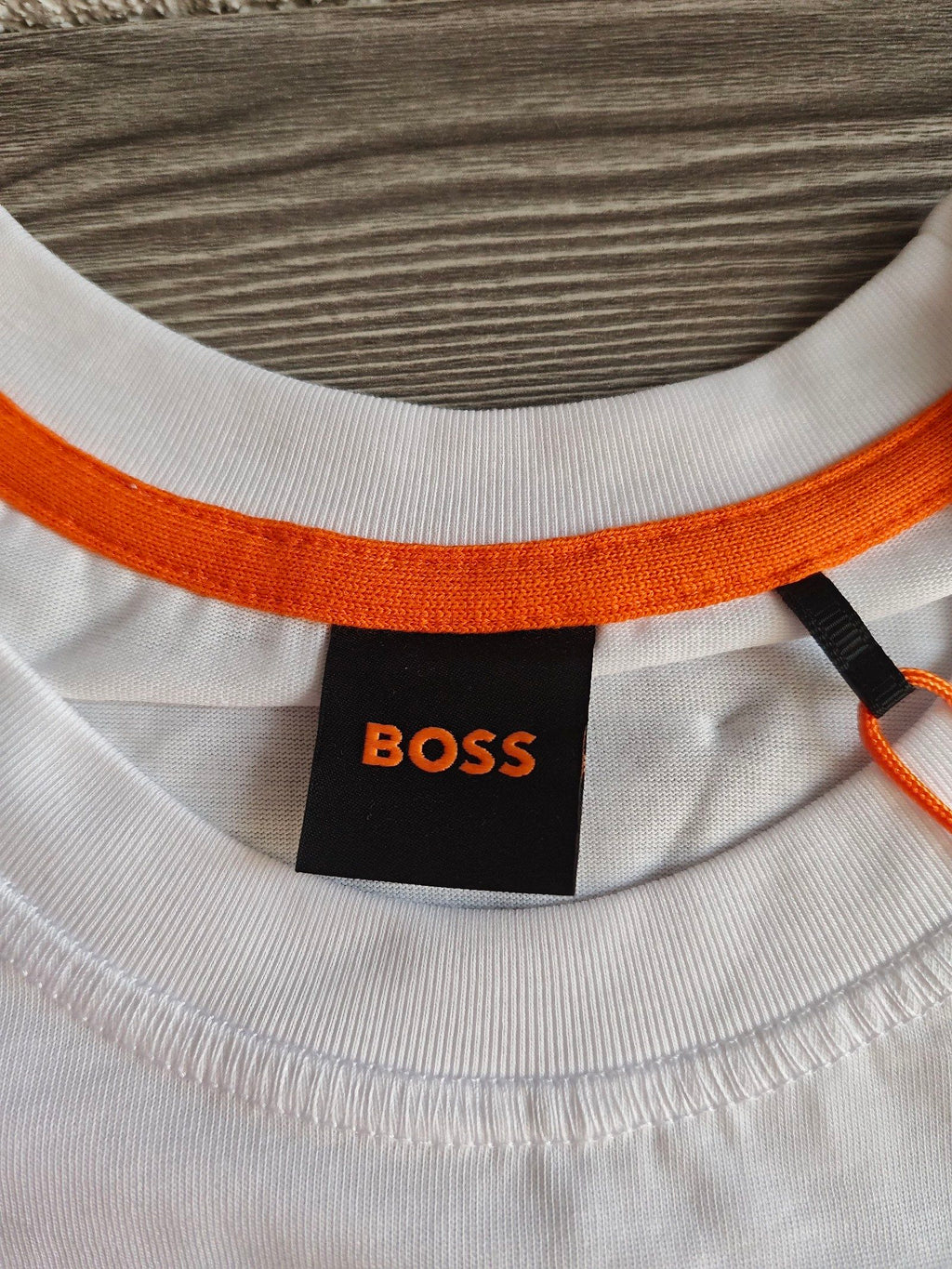 BOSS white graphic t-shirt featuring black and olive all-terrain vehicle print, 100% cotton.