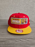 New Era red and yellow snapback hat with embroidered Iron Man patch and Marvel Comics logo.