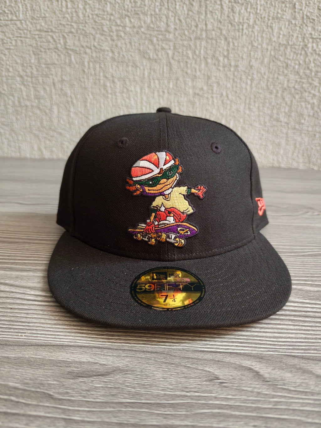 New Era black fitted cap with Rocket Power character embroidery and colorful details.