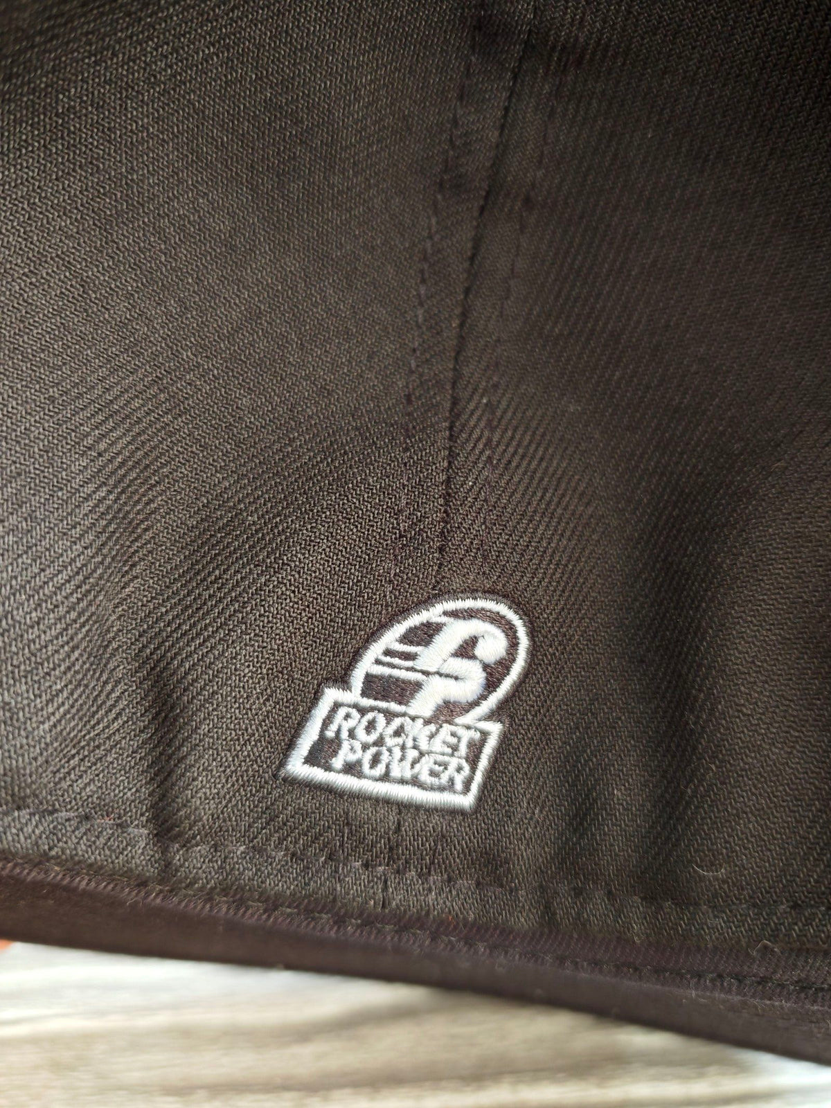 New Era black fitted cap with Rocket Power character embroidery and colorful details.