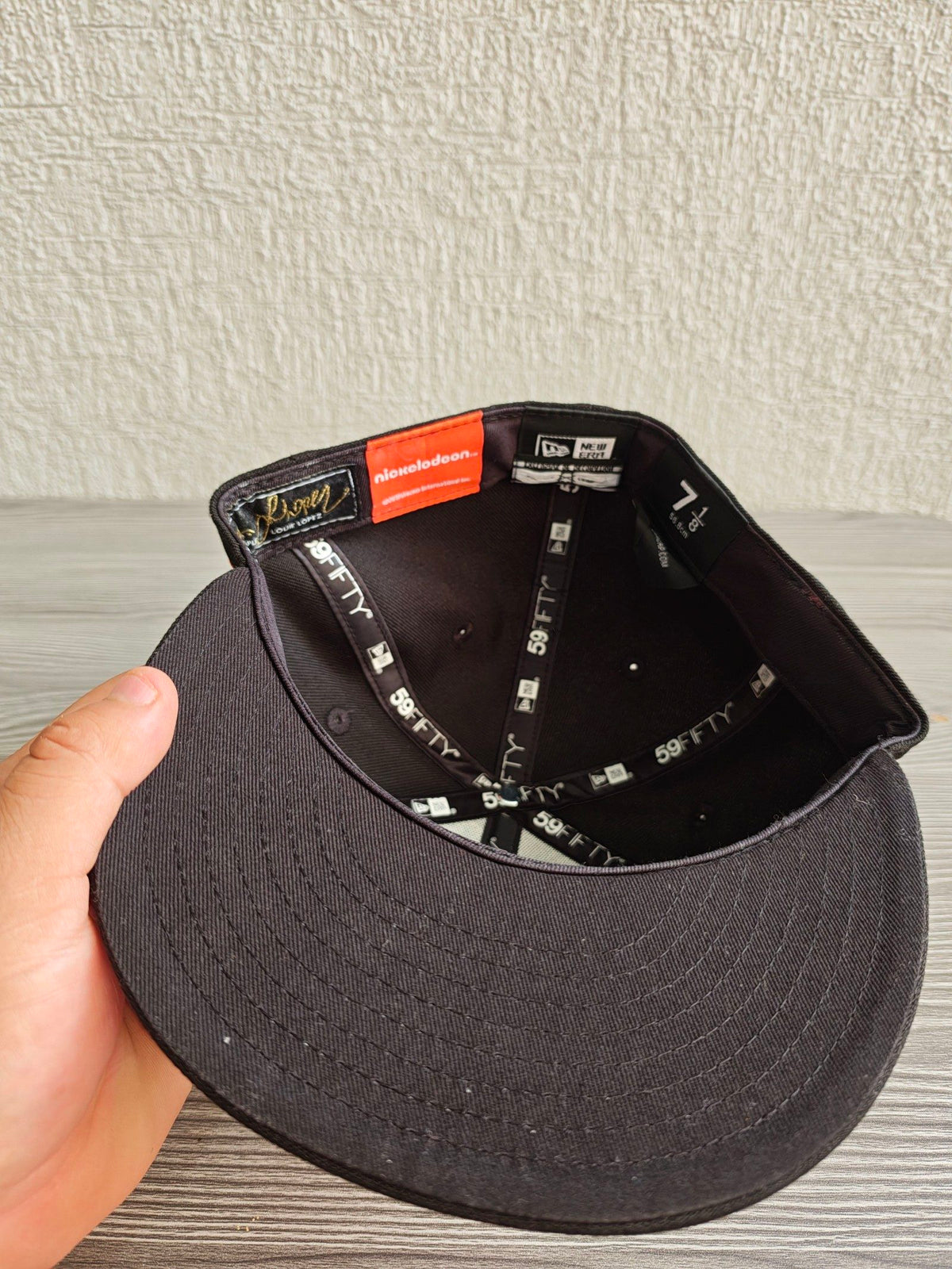 New Era black fitted cap with Rocket Power character embroidery and colorful details.