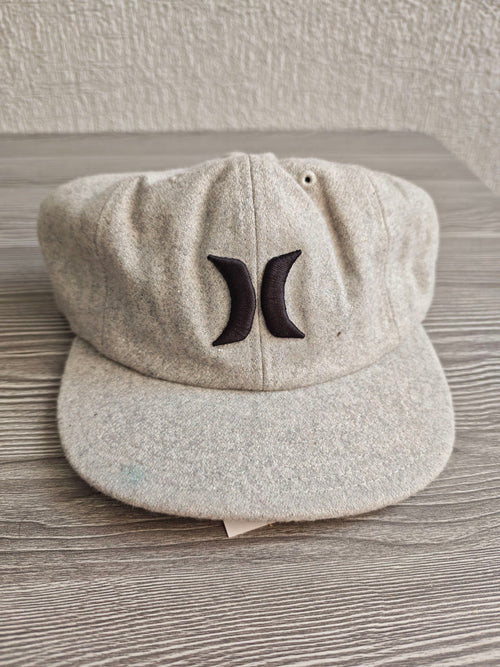 Hurley grey wool baseball cap with black embroidered logo and six ventilation eyelets.