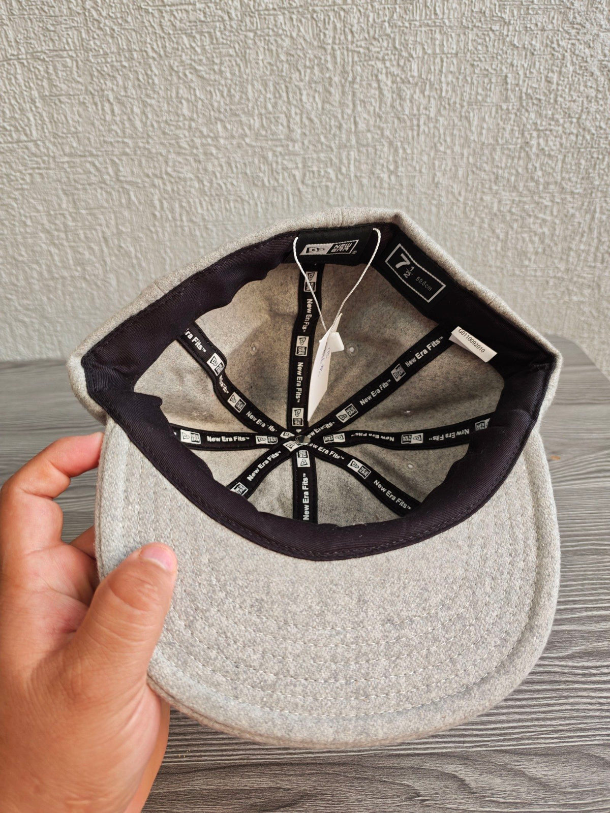 Hurley grey wool baseball cap with black embroidered logo and six ventilation eyelets.
