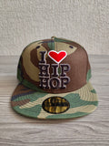 New Era beige camouflage cap embroidered 'I ❤️ HIP HOP' and logo tape.