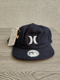 Hurley navy bucket hat with embroidered logo and structured 8-panel design.