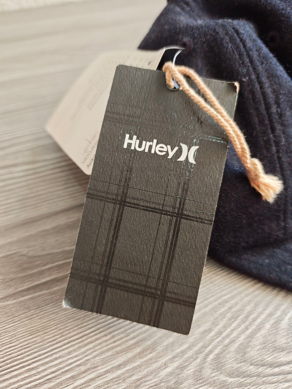 Hurley navy bucket hat with embroidered logo and structured 8-panel design.