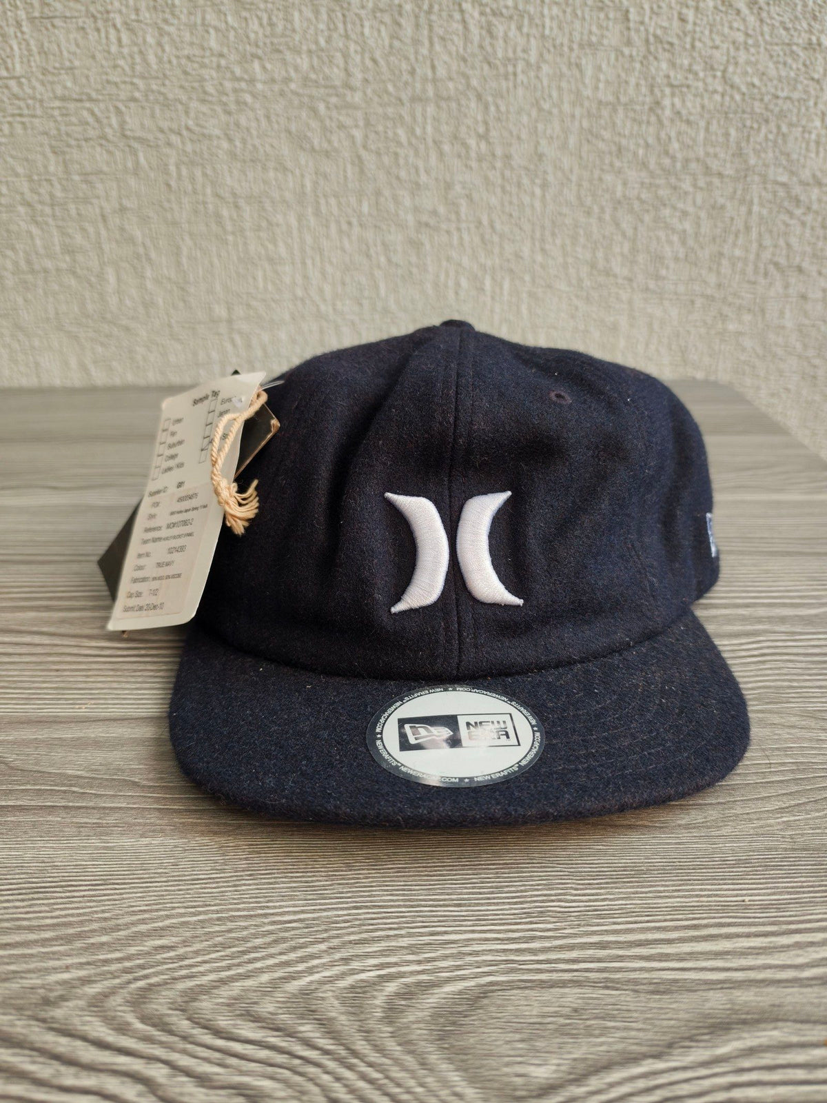 Hurley navy 8 panel cap with white embroidered logo, wool blend material.