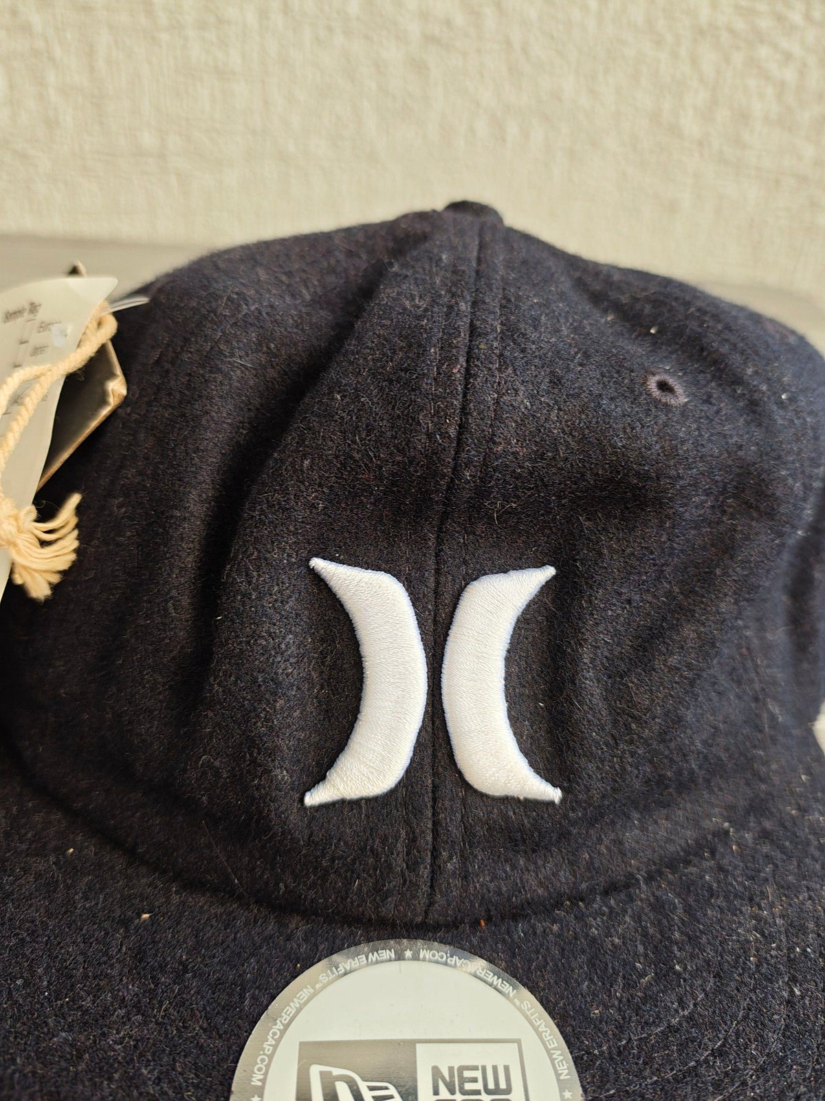 Hurley navy 8 panel cap with white embroidered logo, wool blend material.