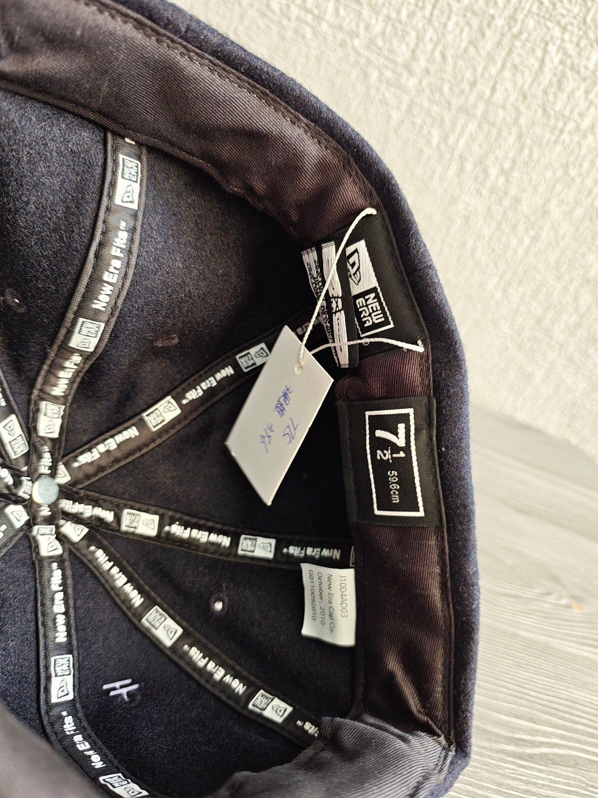 Hurley navy 8 panel cap with white embroidered logo, wool blend material.