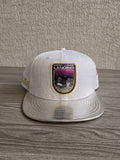 New Era red snapback cap with white textured fabric and embroidered lunar landing patch.
