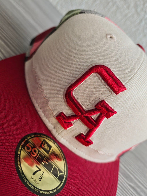 New Era red and cream fitted cap with CA logo and multicolored plaid pattern.